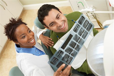 simsearch:693-06014951,k - Dentist and patient examining X-ray in surgery Stock Photo - Premium Royalty-Free, Code: 693-06014958