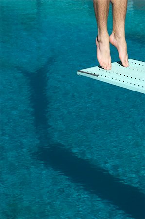 Male swimmer standing on diving board Stock Photo - Premium Royalty-Free, Code: 693-06015104