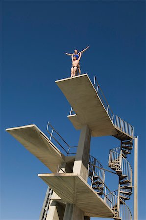 Two swimmers standing on diving board Stock Photo - Premium Royalty-Free, Code: 693-06015123