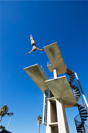 Swimmer diving from diving board Stock Photo - Premium Royalty-Free, Code: 693-06015131