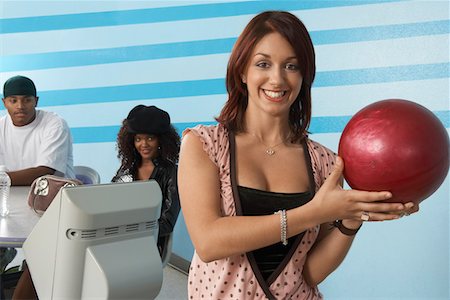 simsearch:693-06015216,k - Young woman at bowling alley holding ball, portrait Stock Photo - Premium Royalty-Free, Code: 693-06015198