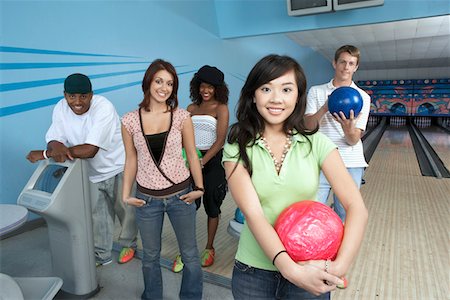 simsearch:693-06015216,k - Group of friends at bowling alley, some holding balls, portrait Stock Photo - Premium Royalty-Free, Code: 693-06015209