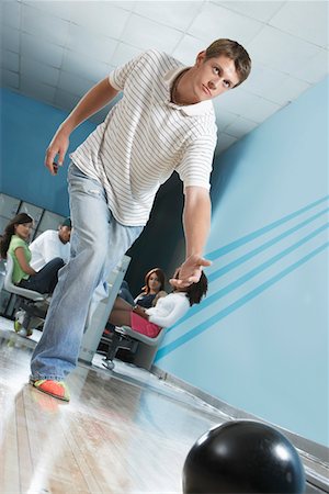 simsearch:693-06015216,k - Young man releasing bowling ball, portrait Stock Photo - Premium Royalty-Free, Code: 693-06015216