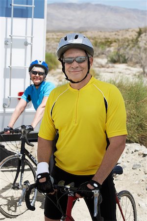 simsearch:693-06015367,k - Couple preparing for bicycle ride, portrait Stock Photo - Premium Royalty-Free, Code: 693-06015358