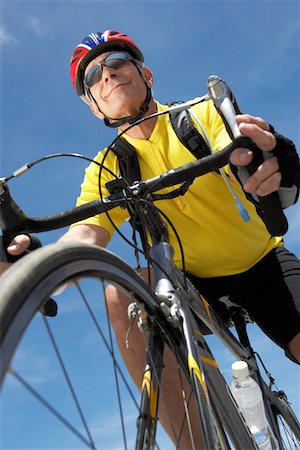 simsearch:693-06015367,k - Man on bicycle ride, low angle view Stock Photo - Premium Royalty-Free, Code: 693-06015369