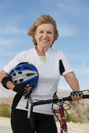 simsearch:693-06015367,k - Woman with bicycle and helmet, portrait Stock Photo - Premium Royalty-Free, Code: 693-06015361