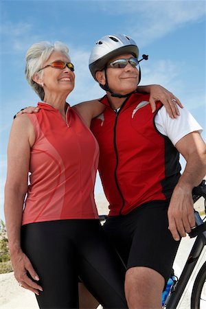 shoulder ride older men - Couple on bicycle ride, portrait Stock Photo - Premium Royalty-Free, Code: 693-06015373