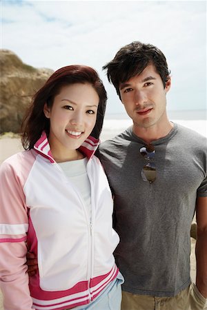Young couple on beach, portrait Stock Photo - Premium Royalty-Free, Code: 693-06015462