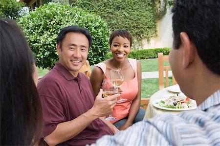 simsearch:693-06015925,k - Two couples drinking wine in garden Stock Photo - Premium Royalty-Free, Code: 693-06015914