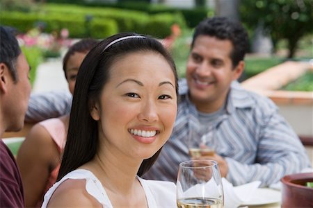 simsearch:693-06015925,k - Woman drinking wine with friends outdoors Stock Photo - Premium Royalty-Free, Code: 693-06015912