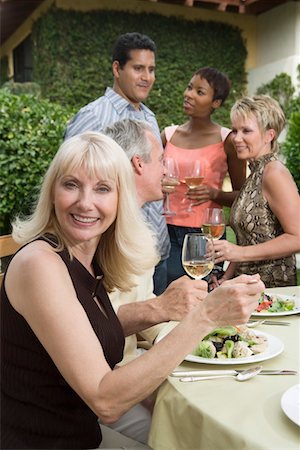 simsearch:693-06015925,k - Woman drinking wine with friends outdoors Stock Photo - Premium Royalty-Free, Code: 693-06015922