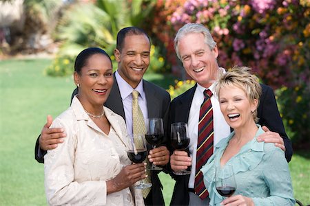 simsearch:693-06015925,k - Two couples holding wine outdoors, portrait Stock Photo - Premium Royalty-Free, Code: 693-06016019