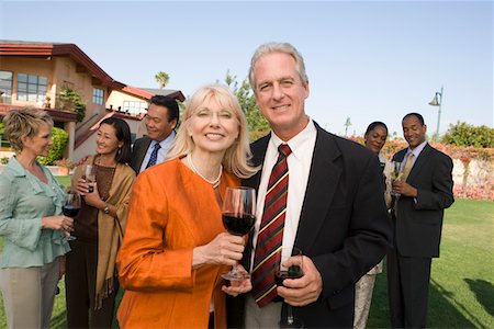 simsearch:693-06015925,k - Couple holding wine at outdoor party, portrait Stock Photo - Premium Royalty-Free, Code: 693-06016022