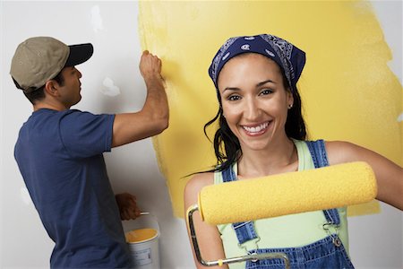 paint on head - Couple painting interior wall yellow Stock Photo - Premium Royalty-Free, Code: 693-06016111