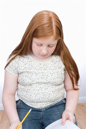 fat girl redhead - Teenage girl learning Foto de stock - Sin royalties Premium, Código: 693-06016266