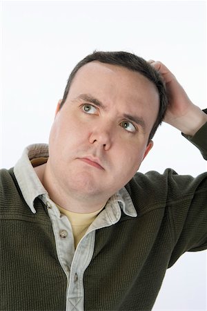 fat man facial expression - Man scratching head, looking up Stock Photo - Premium Royalty-Free, Code: 693-06016287