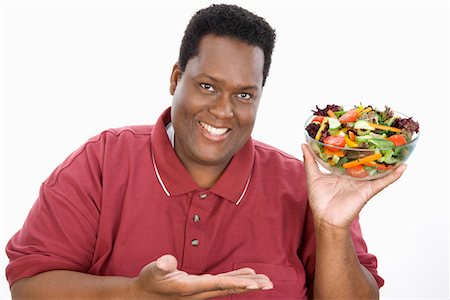 fat people eating healthy food - Man Holding Salad Stock Photo - Premium Royalty-Free, Code: 693-06016395