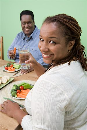 Overweight mid-adult couple having healthy meal Stock Photo - Premium Royalty-Free, Code: 693-06016432