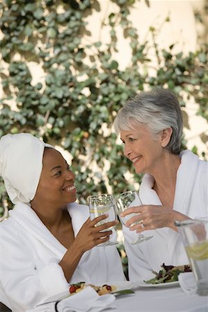 spa with female friend - Two women in bathrobes, toasting drinks Stock Photo - Premium Royalty-Free, Code: 693-06016566