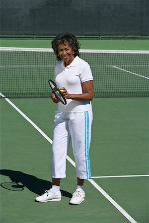 Female tennis player on court, portrait Stock Photo - Premium Royalty-Free, Code: 693-06016637