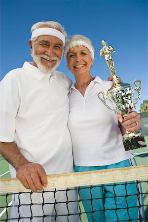 simsearch:693-06016661,k - Tennis players holding award cup Stock Photo - Premium Royalty-Free, Code: 693-06016655