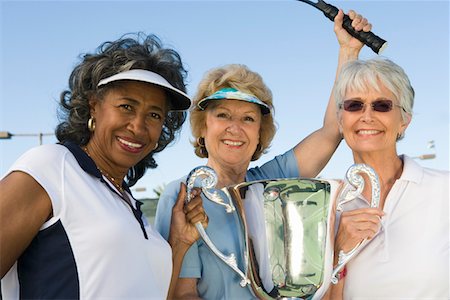Tennis players with award cup Stock Photo - Premium Royalty-Free, Code: 693-06016659