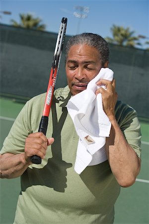 Tennis player toweling face Stock Photo - Premium Royalty-Free, Code: 693-06016651