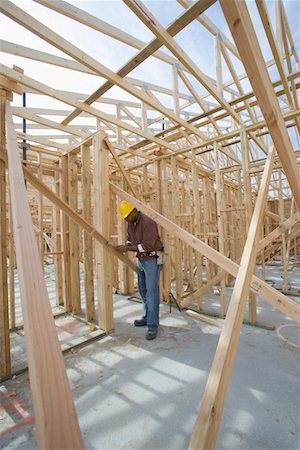 simsearch:693-06016707,k - Construction worker checking framework Foto de stock - Sin royalties Premium, Código: 693-06016732