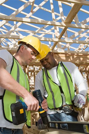 drilling african american - Two construction workers drilling on site Stock Photo - Premium Royalty-Free, Code: 693-06016746