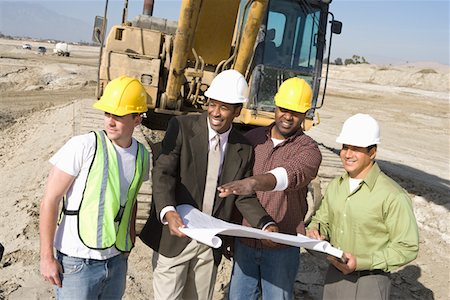 Surveyor and construction workers on site Stock Photo - Premium Royalty-Free, Code: 693-06016802