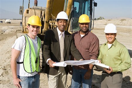 Surveyor and construction workers on site, portrait Stock Photo - Premium Royalty-Free, Code: 693-06016803