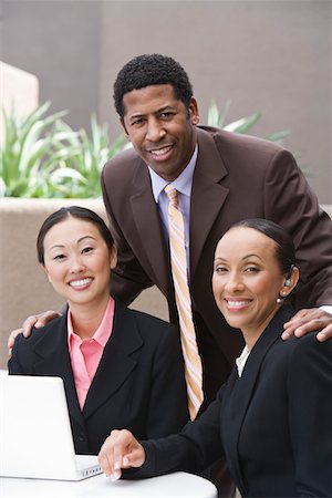 Three business people having meeting Stock Photo - Premium Royalty-Free, Code: 693-06017340