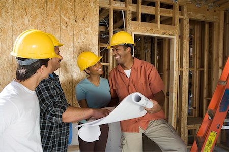 simsearch:693-06016692,k - Couple consulting workers on construction site Stock Photo - Premium Royalty-Free, Code: 693-06017947