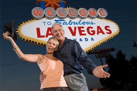 simsearch:693-06018149,k - Portrait of middle-aged couple in front of Welcome to Las Vegas sign, low angle view Stock Photo - Premium Royalty-Free, Code: 693-06018085