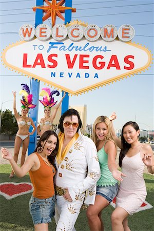 simsearch:693-06018149,k - Women and Elvis impersonator posing in front of Las Vegas welcome sign, Nevada, USA Stock Photo - Premium Royalty-Free, Code: 693-06018148