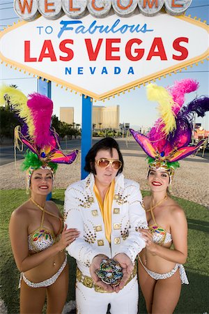 simsearch:693-06018149,k - Female dancers and Elvis impersonator posing in front of Las Vegas welcome sign, Nevada, USA Stock Photo - Premium Royalty-Free, Code: 693-06018152