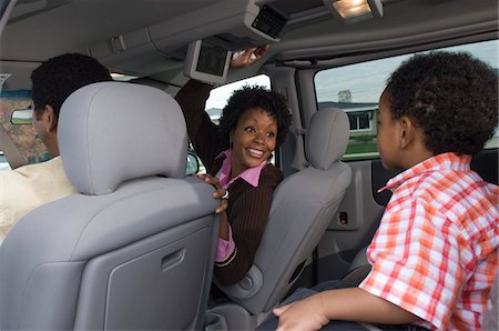 Family with one child (5-6) in car Stock Photo - Premium Royalty-Free, Code: 693-06018218