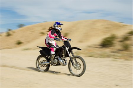 Motocross racer on bike in desert Stock Photo - Premium Royalty-Free, Code: 693-06018242