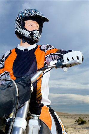 Motocross racer on bike in desert Stock Photo - Premium Royalty-Free, Code: 693-06018254