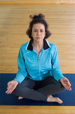 senior woman meditating - Senior Woman Meditating Stock Photo - Premium Royalty-Free, Code: 693-06018278