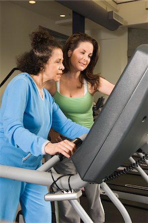 Personal Trainer Working with Senior Woman Stock Photo - Premium Royalty-Free, Code: 693-06018305
