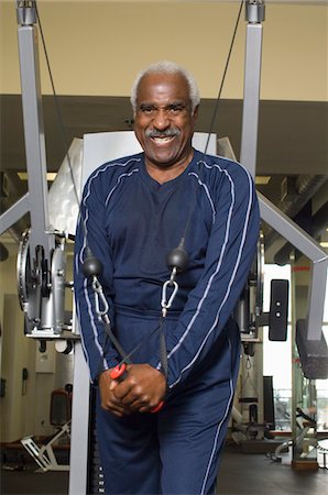 fit older black man in gym - Senior Man Working Out on Weightlifting Machine Stock Photo - Premium Royalty-Free, Code: 693-06018335