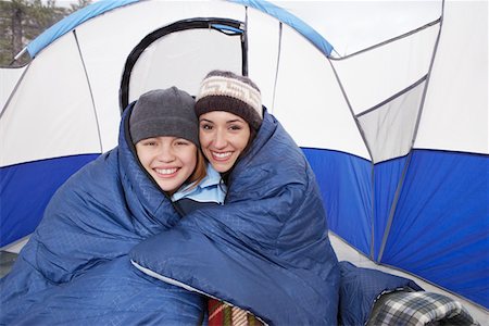 sleeping bag woman - Mother and daughter (10-12) in tent, (portrait) Stock Photo - Premium Royalty-Free, Code: 693-06018348