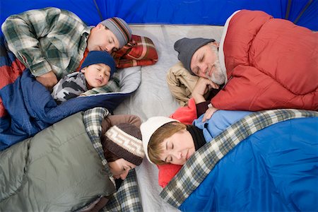 sleeping bag woman - Family sleeping in tent Stock Photo - Premium Royalty-Free, Code: 693-06018363