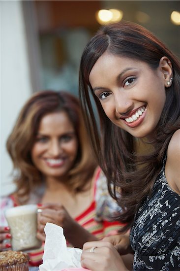 Portrait of two women at cafe table Stock Photo - Premium Royalty-Free, Image code: 693-06019319