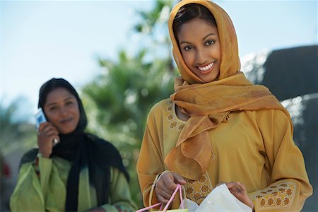 Two muslim woman, one with shopping bag Stock Photo - Premium Royalty-Free, Code: 693-06019324