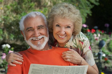 simsearch:693-06019332,k - Senior couple reading newspaper in garden, portrait Stock Photo - Premium Royalty-Free, Code: 693-06019333