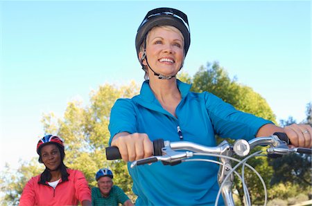 Three seniors riding bicycles Stock Photo - Premium Royalty-Free, Code: 693-06019402