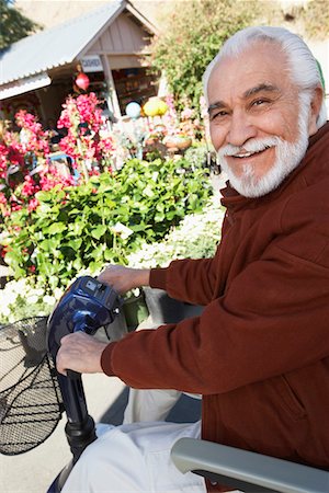simsearch:693-06019332,k - Elderly man on motor scooter Stock Photo - Premium Royalty-Free, Code: 693-06019441