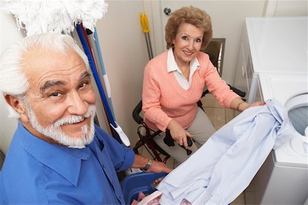 picture of elderly cheering - Couple with laundry by washing machine Stock Photo - Premium Royalty-Free, Code: 693-06019443